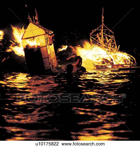 Stock Image - People in Background, Small Group of Objects, Outdoors, Night. Fotosearch