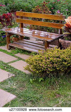 Stock Photo - Bench in garden . Fotosearch