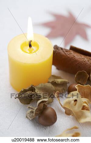 Stock Photo - A burning aroma candle. Fotosearch