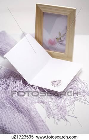 Stock Photography - Picture frame and card along with yarn scarf. Fotosearch