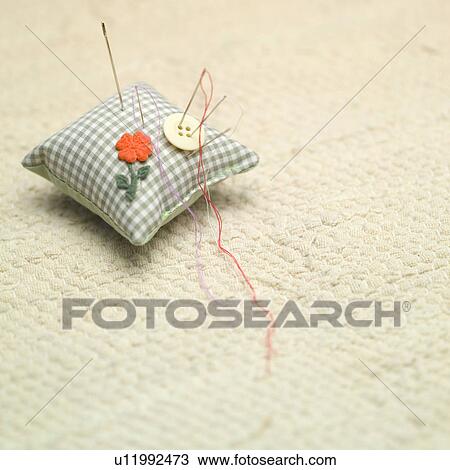 Stock Image - Pin cushion and needles. Fotosearch