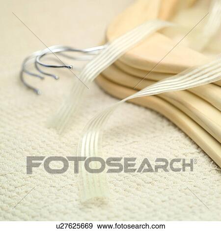 Ribbon along with cloth hangers View Large Photo Image Stock Photo - Ribbon along with cloth hangers. Fotosearch
