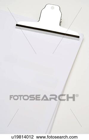 Stock Image - Bulldog clip on sheets of paper. Fotosearch