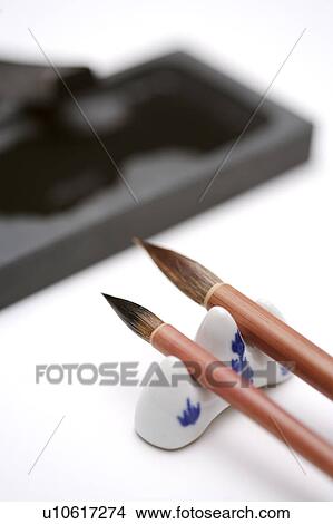 Picture - Calligraphy brushes with ink-stone slab. Fotosearch