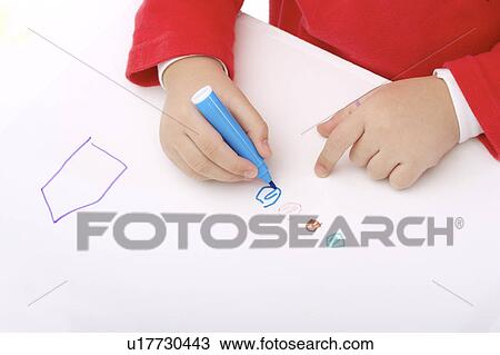 Child drawing on paper with color pen View Large Photo Image Stock Image - Child drawing on paper with color pen. Fotosearch