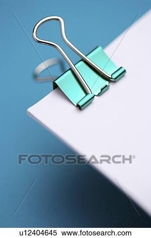 Clip on a pile of papers View Large Photo Image Stock Photography - Clip on a pile of papers. Fotosearch