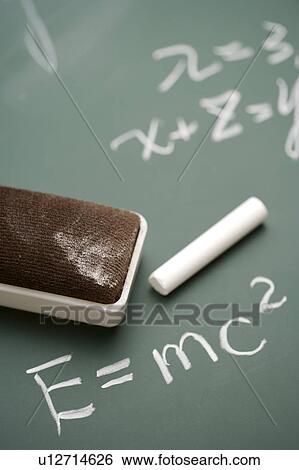 Stock Photograph - Equation on blackboard with chalk and blackboard eraser. Fotosearch