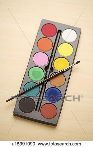 Stock Image - Paints and paintbrush, close-up. Fotosearch