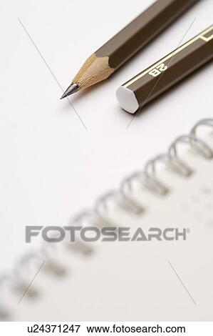 Pencil on notebook View Large Photo Image Stock Photo - Pencil on notebook. Fotosearch