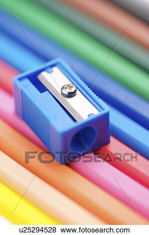 Stock Photo - Pencil sharpener on row of pencils, close-up. Fotosearch
