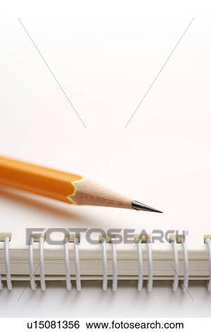 Sharpened pencil on notebook View Large Photo Image Stock Photograph - Sharpened pencil on notebook. Fotosearch