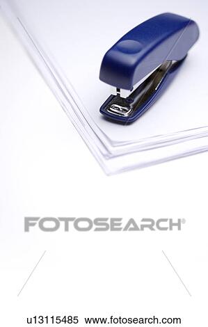 Staple on a pile of papers View Large Photo Image Stock Photography - Staple on a pile of papers. Fotosearch
