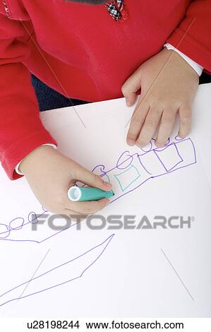 Young boy drawing on paper View Large Photo Image Picture - Young boy drawing on paper. Fotosearch