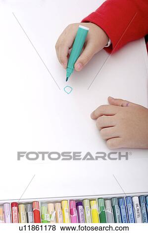 Young boy drawing on paper View Large Photo Image Stock Photo - Young boy drawing on paper. Fotosearch