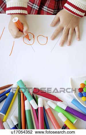 Young girl drawing on paper View Large Photo Image Stock Image - Young girl drawing on paper. Fotosearch