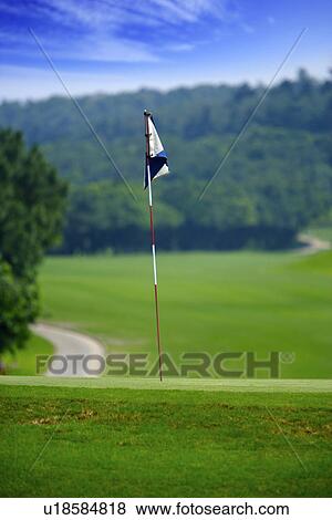 Stock Photo - Flag in golf course. Fotosearch