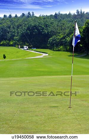 Flag in golf course View Large Photo Image Stock Photo - Flag in golf course. Fotosearch