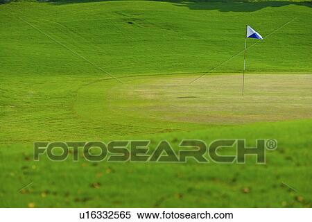Stock Photography - Flag in putting green. Fotosearch