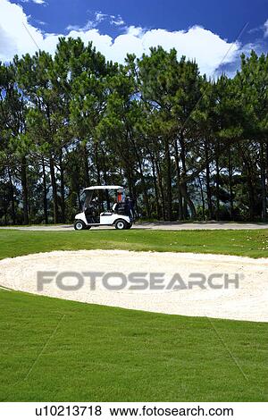 Golf cart in golf course View Large Photo Image Stock Photo - Golf cart in golf course. Fotosearch