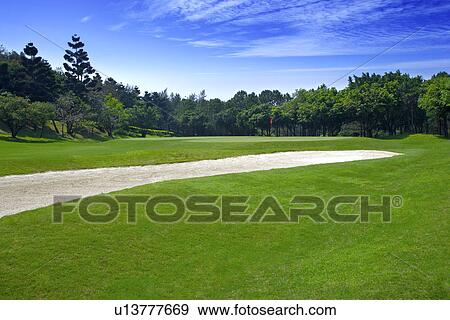 Golf course with green and sand traps View Large Photo Image Stock Photo - Golf course with green and sand traps . Fotosearch