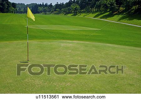 Yellow flag in golf course View Large Photo Image Stock Image - Yellow flag in golf course. Fotosearch