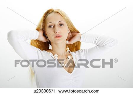 Stock Image - Young woman wearing necklace made of seashells. Fotosearch