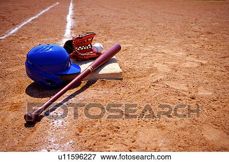 Baseball bat, glove, helmet and ball View Large Photo Image Stock Photo - Baseball bat, glove, helmet and ball . Fotosearch