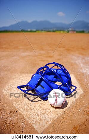 Baseball helmet and ball on home base View Large Photo Image Stock Image - Baseball helmet and ball on home base. Fotosearch