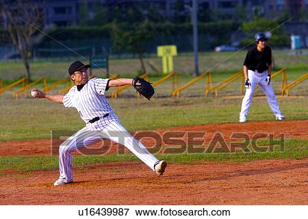 Stock Photo - Baseball pithcer preparing to throw ball. Fotosearch