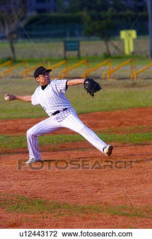 Baseball player preparing to throw ball View Large Photo Image Stock Image - Baseball player preparing to throw ball. Fotosearch