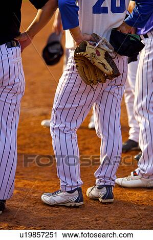 Baseball players, low section View Large Photo Image Stock Image - Baseball players, low section. Fotosearch