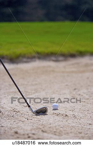 Close-up of a golf club and a golf ball in sand trap View Large Photo Image Stock Photograph - Close-up of a golf club and a golf ball in sand trap . Fotosearch