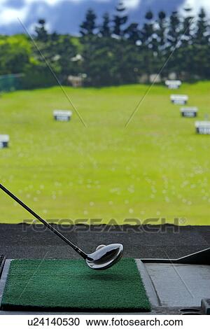 Club lined up with golf ball on driving range (ground view) View Large Photo Image Stock Image - Club lined up with golf ball on driving range (ground view). Fotosearch