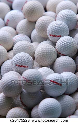 Stock Image - Golf balls, full frame. Fotosearch