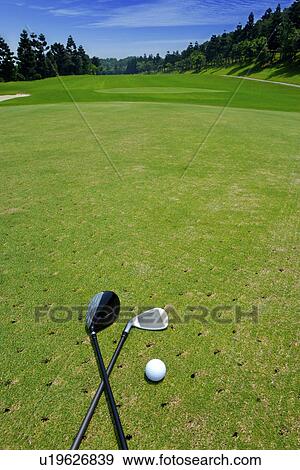 Golf club and golf ball on green View Large Photo Image Stock Photo - Golf club and golf ball on green. Fotosearch