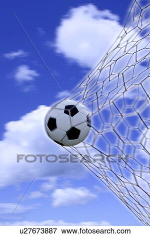 Close-Up of a Football Trapped in a Goal Net on a Football Pitch View Large Photo Image Stock Photo - Close-Up of a Football Trapped in a Goal Net on a Football Pitch . Fotosearch