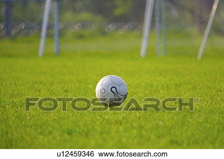 Stock Photograph - Flying soccer ball. Fotosearch