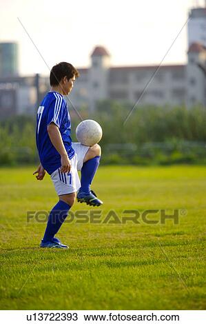 Soccer ball on player's knee View Large Photo Image Stock Image - Soccer ball on player's knee. Fotosearch