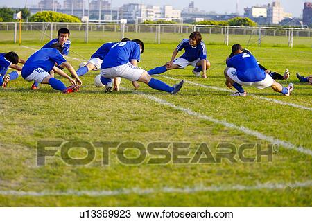 Soccer players warming up on pitch View Large Photo Image Stock Image - Soccer players warming up on pitch. Fotosearch