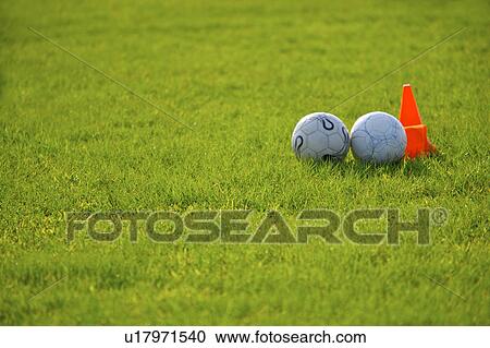 Two soccer balls near red cone View Large Photo Image Stock Image - Two soccer balls near red cone. Fotosearch