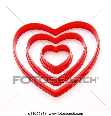Three different-sized heart shaped objects View Large Photo Image Stock Image - Three different-sized heart shaped objects. Fotosearch