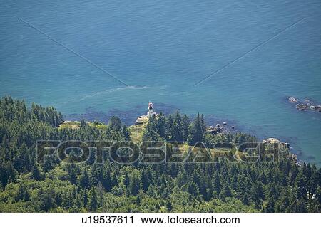 Stock Image - Aerial View of a Light House, West Coast Vancouver Island, British Columbia, Canada. Fotosearch