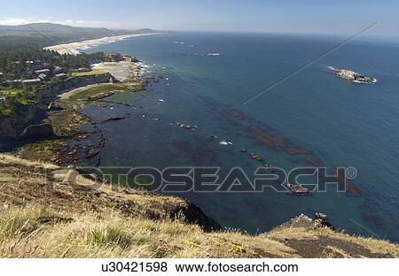 Stock Photo - Aqua coloured ocean and rocky shoreline, Oregon Coast, Oregon, USA. Fotosearch