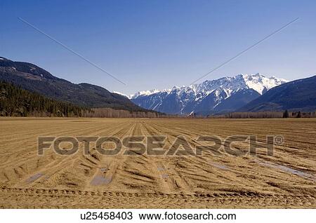 Plowed fields wait for spring planting, Pemberton, BC View Large Photo Image Stock Image - Plowed fields wait for spring planting, Pemberton, BC. Fotosearch
