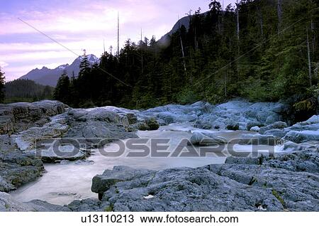 Flowing river at sunset, Vancouver Island, Canada View Large Photo Image Stock Image - Flowing river at sunset, Vancouver Island, Canada. Fotosearch
