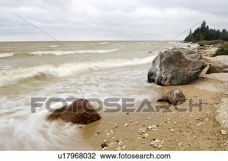 Rocky beach shoreline on an overcast day, Lake Wnnipeg, Canada View Large Photo Image Stock Image - Rocky beach shoreline on an overcast day, Lake Wnnipeg, Canada. Fotosearch