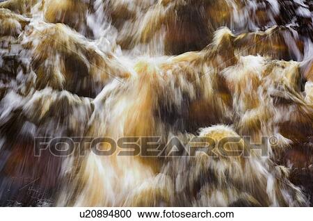 Stock Image - Rushing river. Cape Breton Highlands National Park, Nova Scotia. Fotosearch