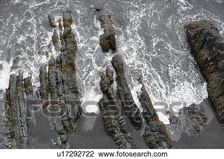 Stock Image - View of rock and wave, Trinity, Newfoundland, Canada. Fotosearch