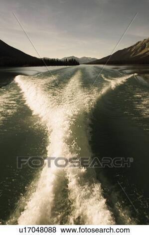 Wake of a boat on Maligne Lake, Jasper National Park, Alberta View Large Photo Image Stock Photo - Wake of a boat on Maligne Lake, Jasper National Park, Alberta. Fotosearch