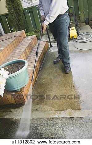 African American man using a power washer, Vancouver, BC View Large Photo Image Stock Image - African American man using a power washer, Vancouver, BC. Fotosearch